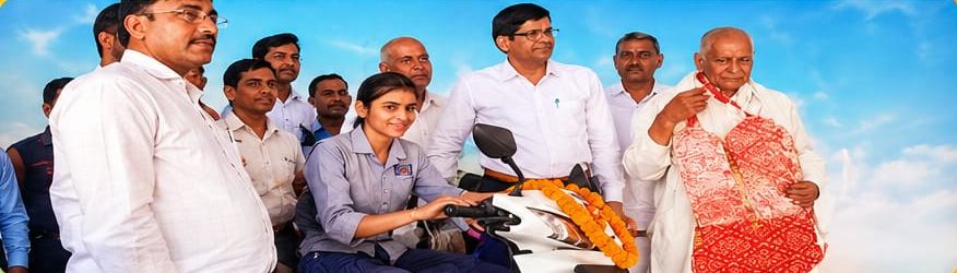 Kashish receiving a scooty for scoring 96% in Class XII