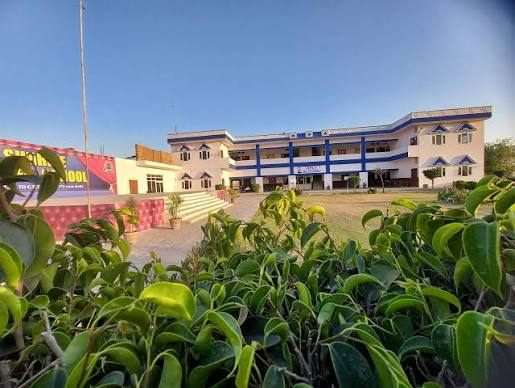 Sun Rise Sr. Sec. School building and front lawn