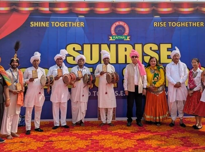 Students performing a cultural programme on stage