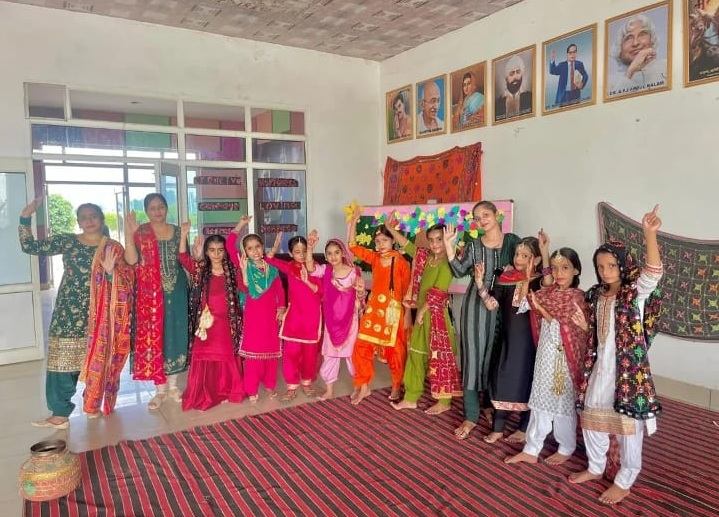 Students in colourful folk dance costumes