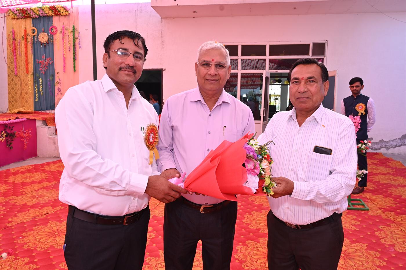 Sun Rise Sr. Sec. School management welcoming guests with a bouquet at the annual function
