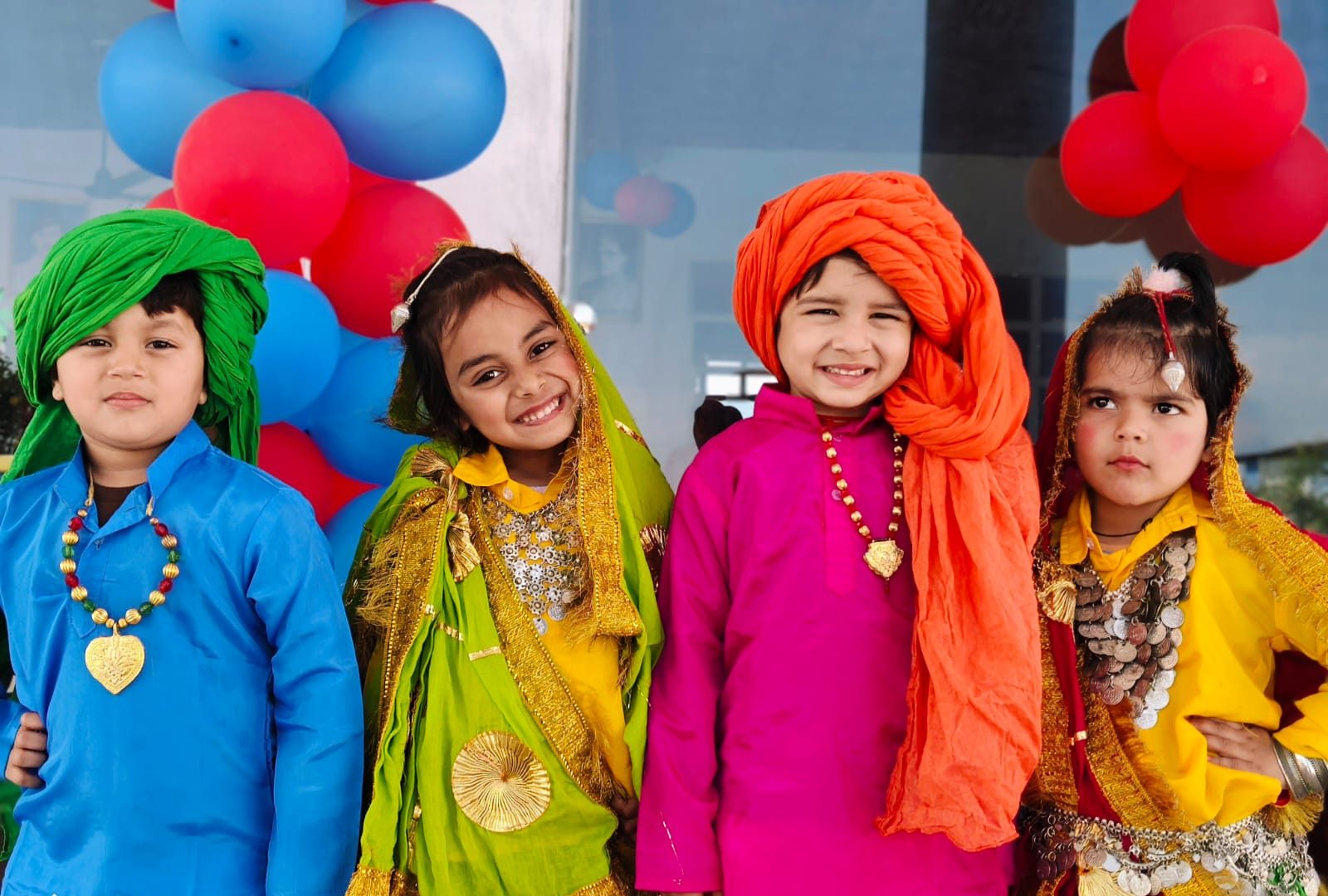 Little ones in colourful traditional attire