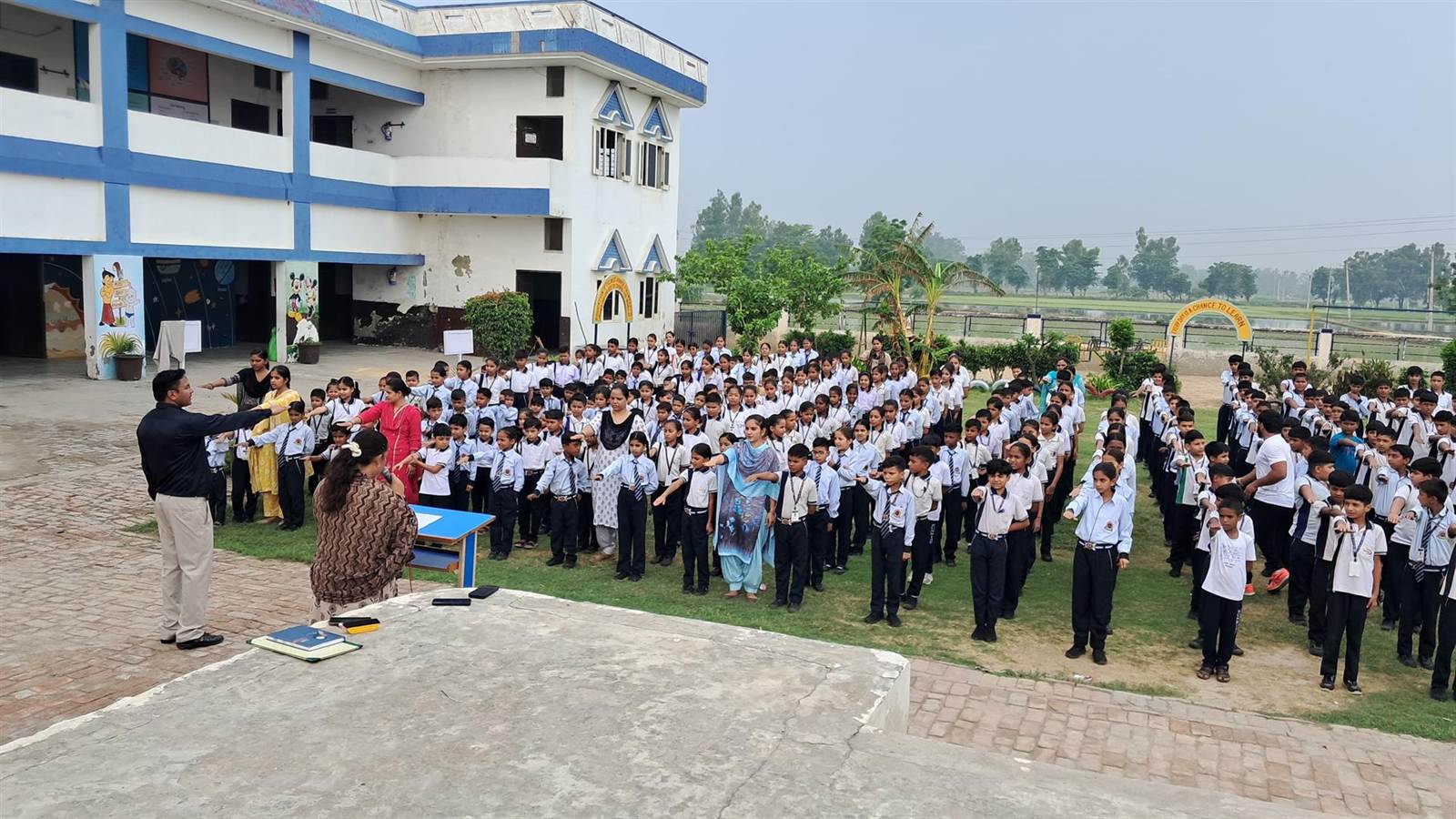 Students of Sun Rise Sr. Sec. School at the morning assembly on the school ground