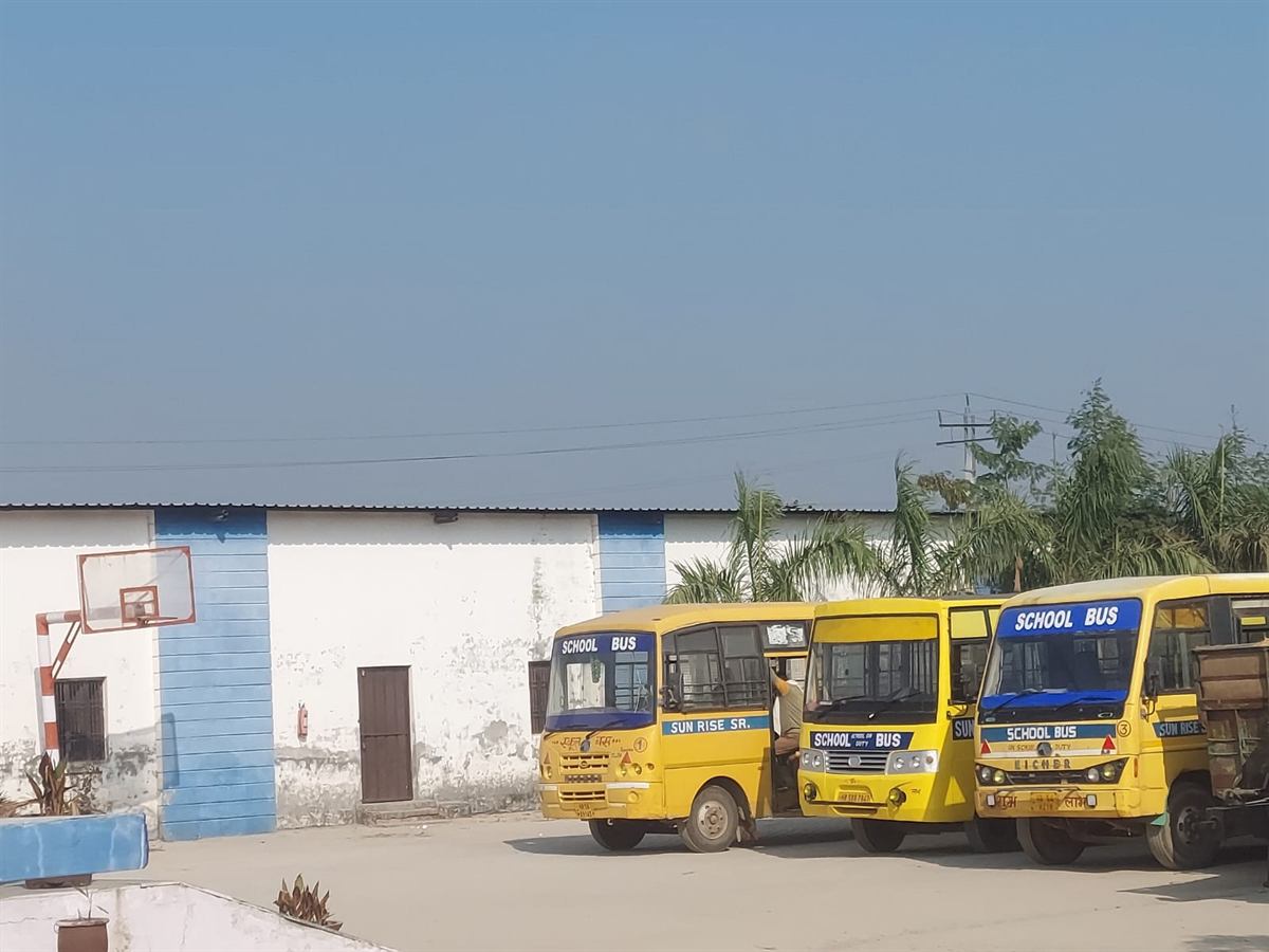 Sun Rise school buses parked on campus