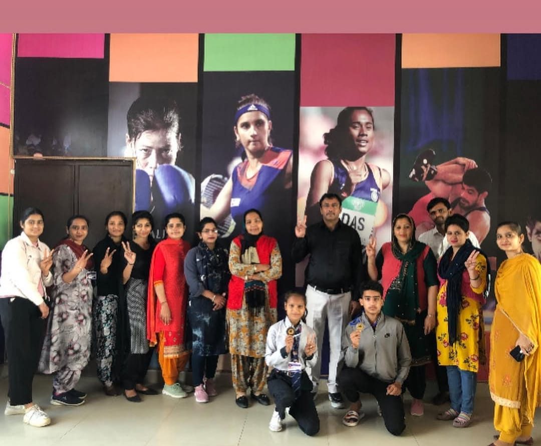 Students with sports coaches and teachers