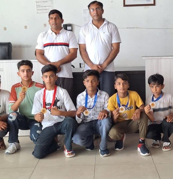 Wushu medal winners with their coach